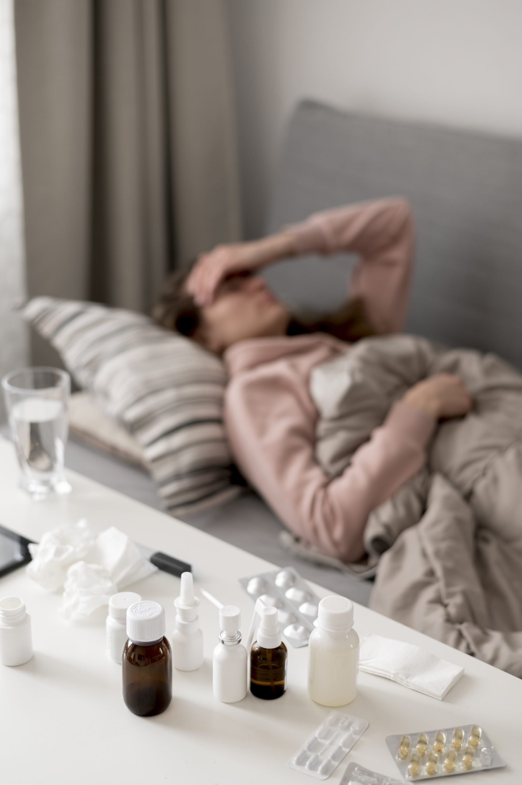 woman-being-sick-laying-bed